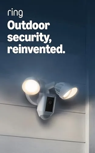 The white Ring Floodlight Cam Wired Plus mounted above a garage door
