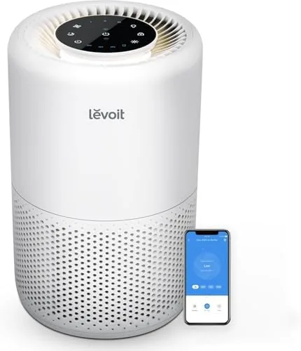 The Levoit Core 200S-P air purifier on a nightstand in a bedroom