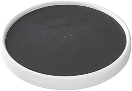 Copco 15 inch lazy susan on a pantry shelf with the raised rim visible