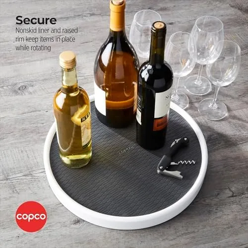 Lazy susan on a refrigerator shelf holding condiment bottles