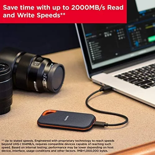 SanDisk Extreme PRO next to its USB-C cable on a workbench