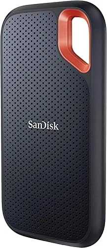The SanDisk 2TB Extreme Portable SSD resting on a desk showing the compact aluminum case