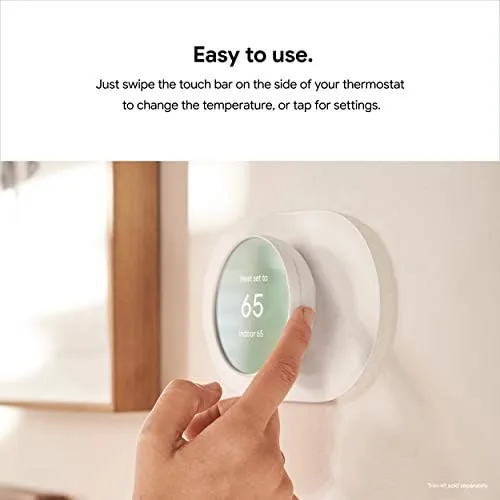 Hand adjusting the temperature on the Google Nest Thermostat