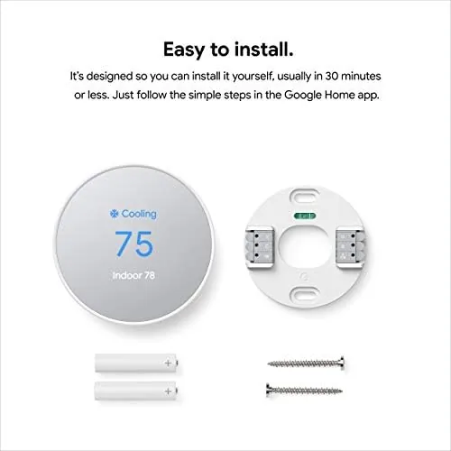 Google Nest Thermostat unboxing showing the device the wall plate and the tools