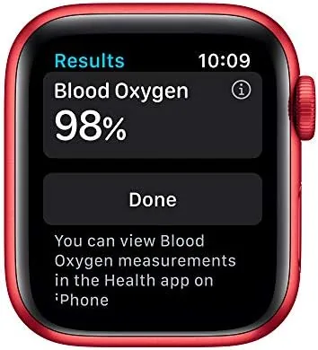 The watch on a wrist during an outdoor run showing the workout screen with pace data
