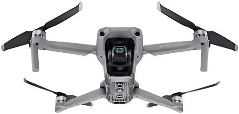 A photographer flying the Mavic Air 2 with the Smart Controller over a field