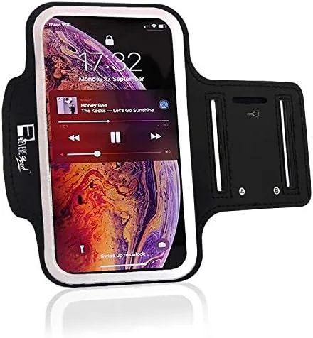 The armband for iPhone Pro Max laid out on a table with its strap and pocket