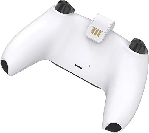 The slim Venom dock next to the wider official DualSense charging dock