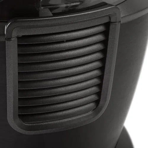 A finished smoothie pouring from the blender pitcher