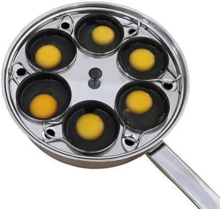 6 cups egg poacher pan on a cooktop with cups in place
