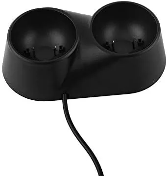 Charging dock on a desk showing both controllers fully charged