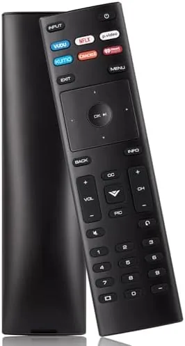 The VIZIO XRT136 replacement remote lying on a coffee table beside a television