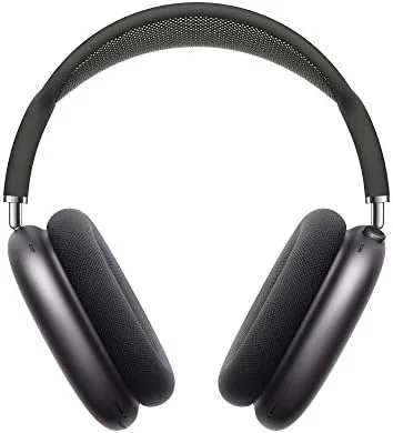 Apple AirPods Max in Space Gray resting on a desk showing the aluminum ear cups and mesh headband