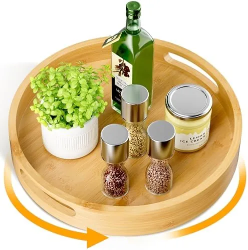 The Homerays 12-inch bamboo lazy susan on a kitchen counter with spice jars