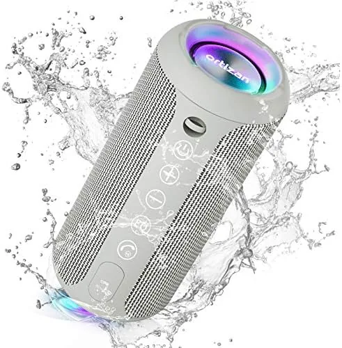 The Ortizan speaker standing on an outdoor table beside a cooler