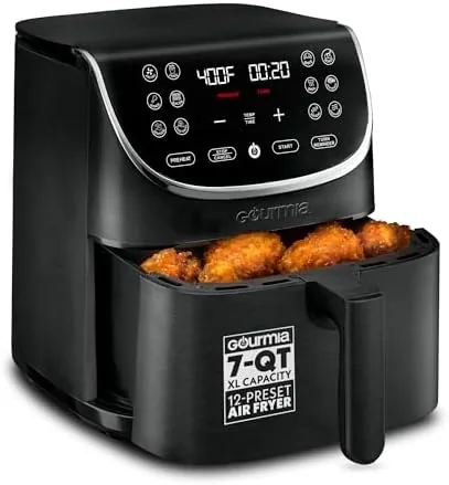 The Gourmia air fryer with its LED display glowing on a kitchen counter