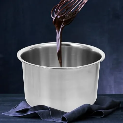 Candle wax melting gently in the upper pot over steaming water