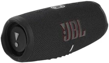 The black JBL Charge 5 speaker standing on a patio table