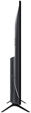Person using the Roku voice remote while watching a show on the 55S421