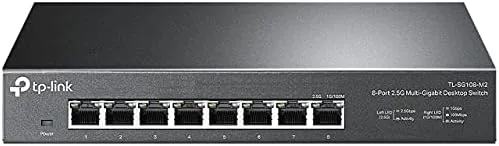 TP-Link TL-SG108-M2 switch on a desk beside a router
