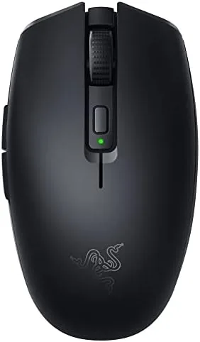 The Razer Orochi V2 wireless mouse sitting on a desk next to a keyboard