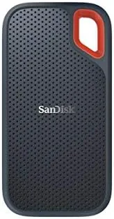 SanDisk 500GB Extreme Portable SSD resting on a desk next to a USB-C cable