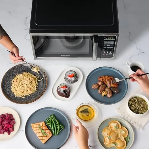 Family hands using the child safety lock on the Farberware microwave
