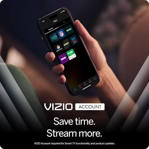 VIZIO TV on a desk in a small home office with a phone casting to it