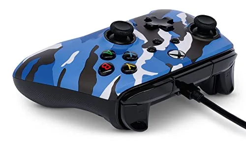 The PowerA controller connected to an Xbox Series X console in a living room