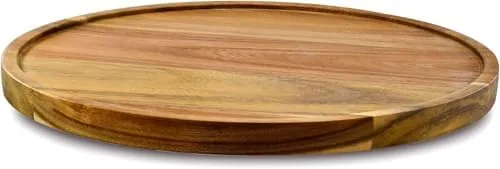 The 10-inch acacia wood lazy susan on a kitchen countertop