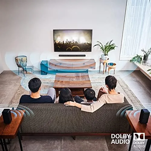 Soundbar connected to a TV with the subwoofer beside it