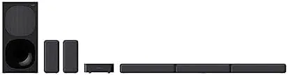 Rear speakers placed on a couch side table during a gaming session