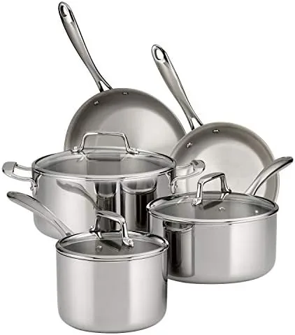 Tramontina Boston tri-ply cookware set arranged with glass lids