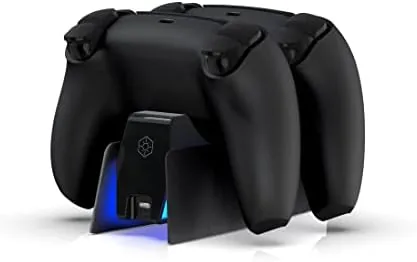 The PS5 charging dock on a TV stand beside a PlayStation 5 console