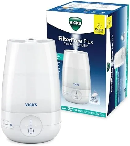 Vicks FilterFree Plus cool mist humidifier on a nightstand