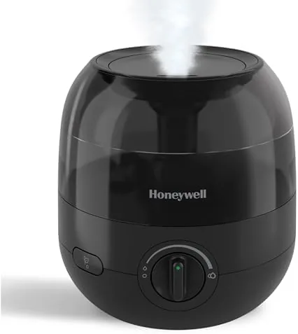 Honeywell mini cool mist humidifier on a nightstand