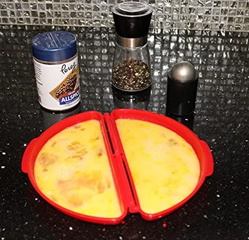 The microwave egg cooker pieces being rinsed in a sink to show easy cleanup