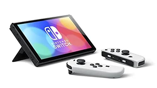 The OLED model docked next to a television for comparison