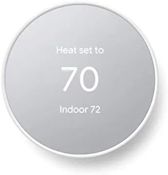 Google Nest Thermostat in Snow finish mounted on a living room wall