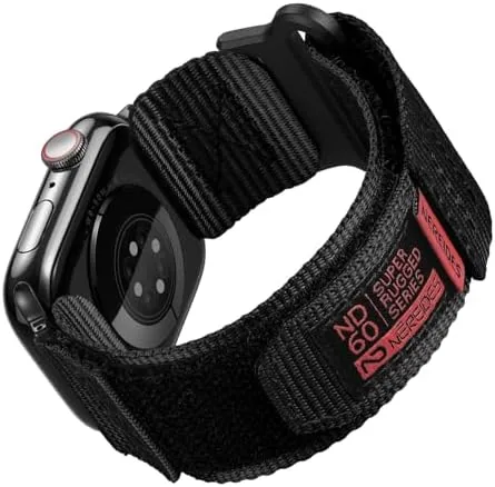 The black rugged nylon Apple Watch band fitted on a watch in a workshop setting