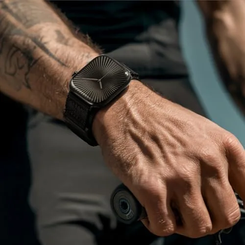 Close-up of the black nylon weave and metal hardware on the rugged Apple Watch band