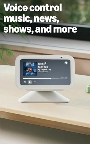 Echo Show 5 Charcoal in a home office with soft lamp light