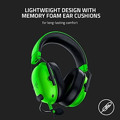 Headset hanging on a stand beside a gaming setup