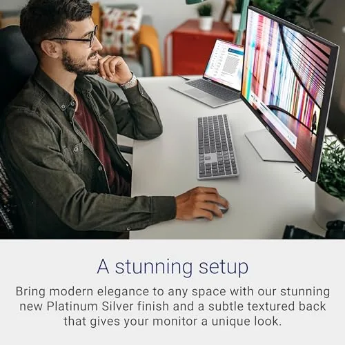 Dell S2722QC displaying a colorful desktop with a laptop connected by USB-C