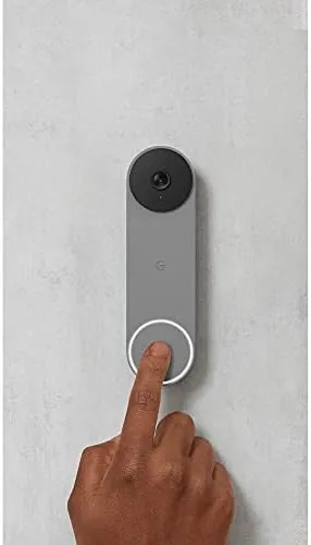 Delivery package at the door with the Nest Doorbell zoomed in on the label
