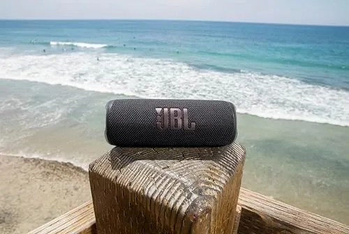 JBL Flip 6 speaker near the edge of a pool