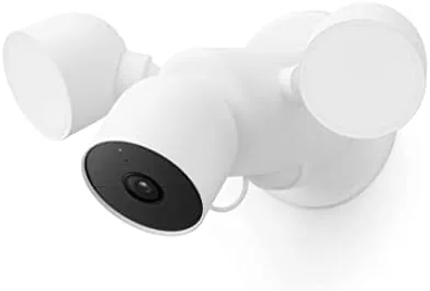 The Google Nest Cam with Floodlight mounted above a side door at dusk