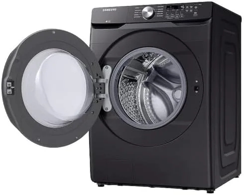 Clean laundry being pulled from the washer drum