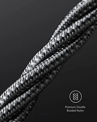 Coiling one cable tightly to test durability before packing it for travel