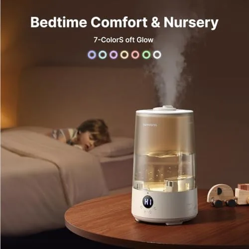 Humidifier running beside a bed with the dim night light on
